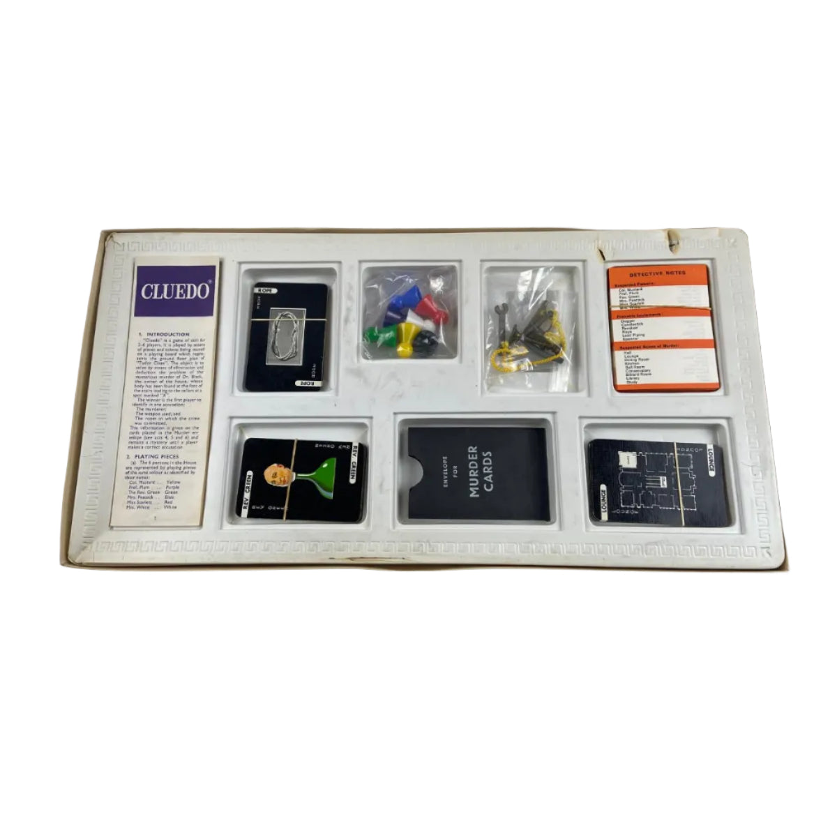 Collection of cards and items in a display case on a white background