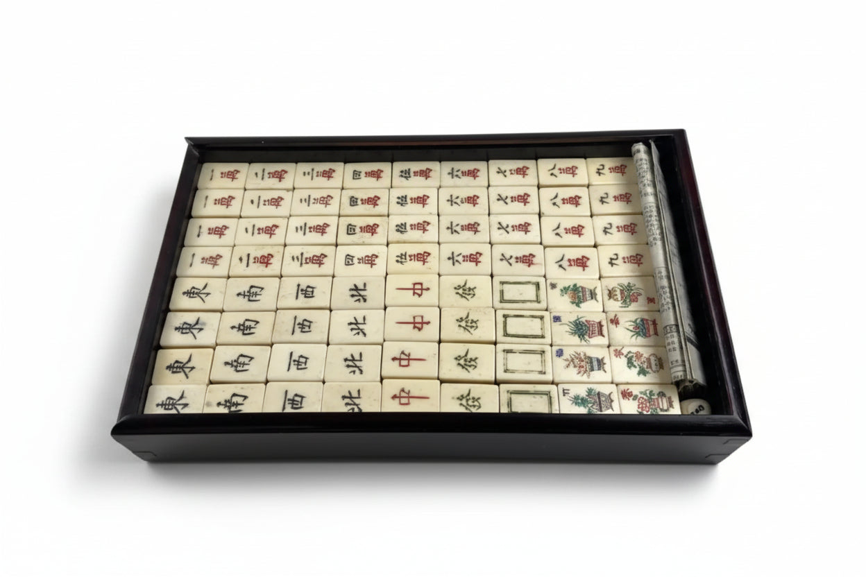 Set of mah jong tiles in open box